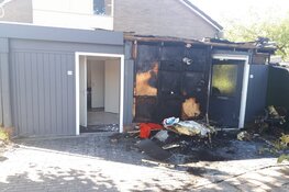 Woningen beschadigd bij brand in vuilcontainer